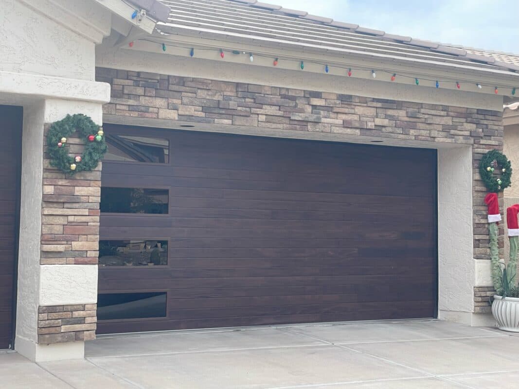Modern wood-look door on stone home
