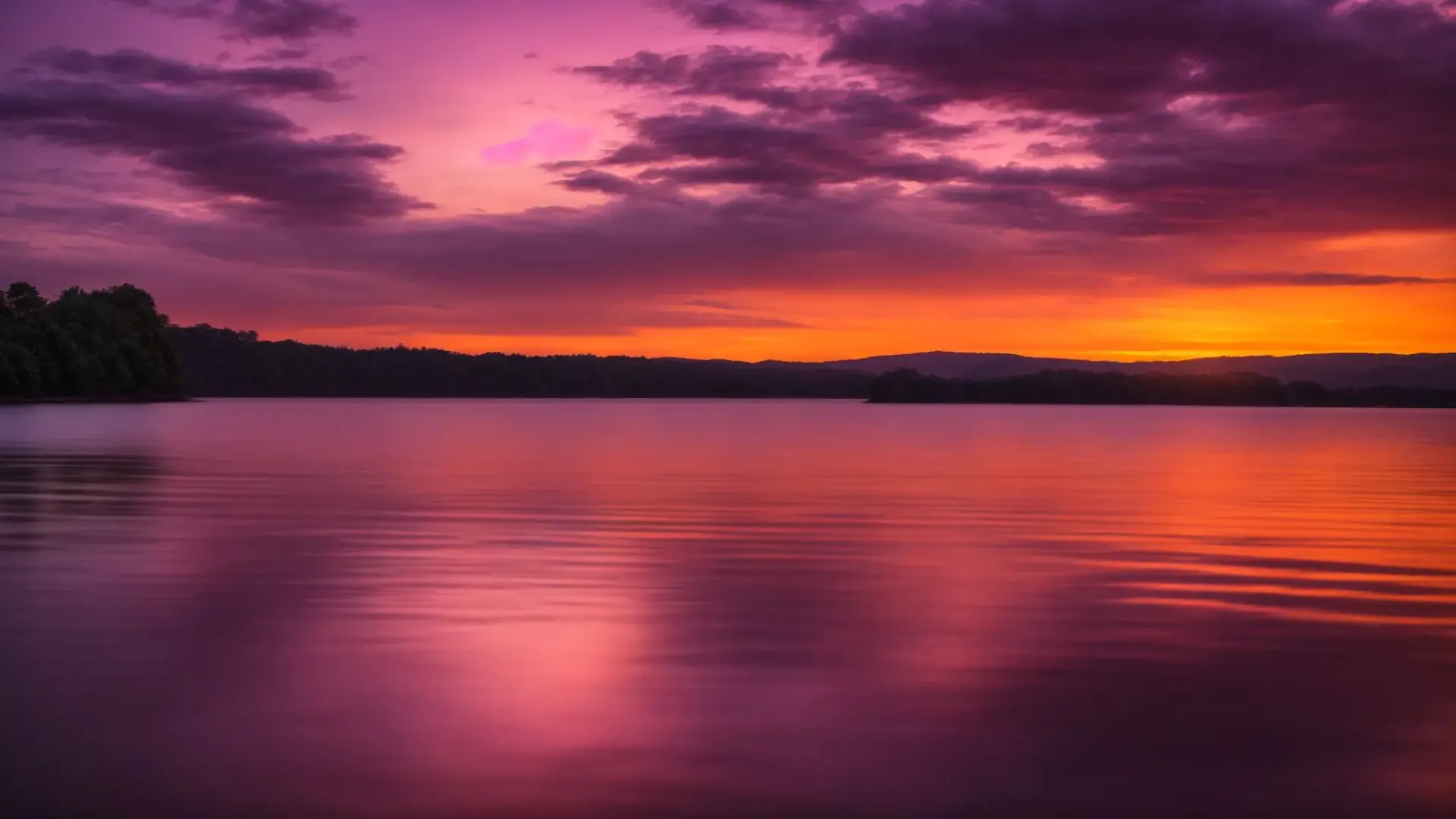 a breathtaking sunset casts vibrant hues of orange and purple across a serene lake, reflecting a peaceful sky dotted with wispy clouds.